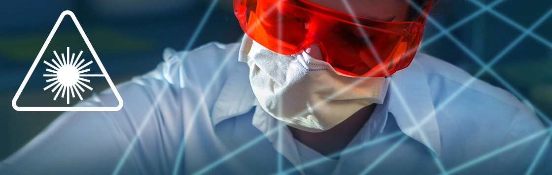 Researcher wearing protective eyewear in a laser laboratory